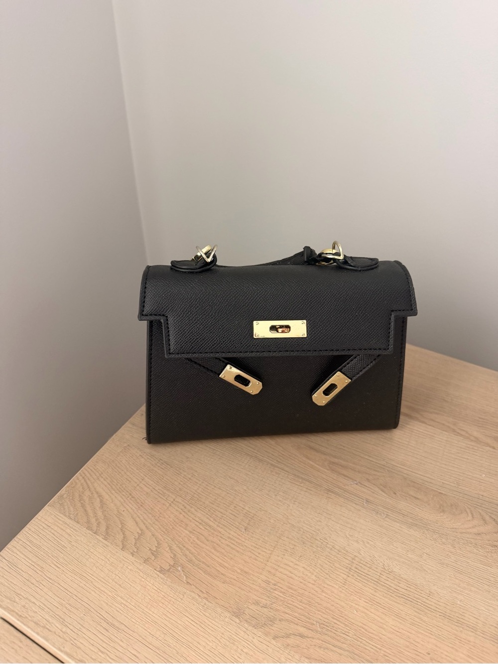 Structured Black Leather Top-Handle Bag with Gold Hardware